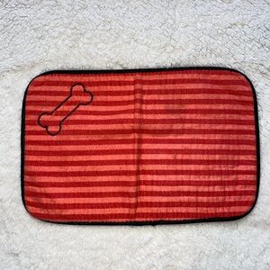 Striped Red Dog Mat with Bone Design